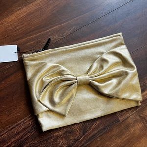 Large gold Kate spade clutch